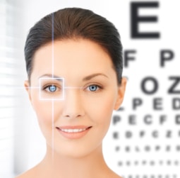 woman in front of an eye exam poster