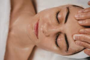 Relaxed woman undergoes a facial at her local medspa.