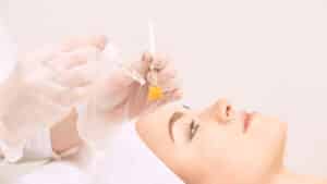 Woman gets a chemical peel to improve her skin health and facial appearance