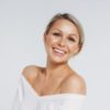 Use Kybella to target an unwanted double chin woman looking beautiful after med spa treaments