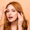 Dysport vs. Botox: What’s the Real Difference? Woman excited by her smooth forehead after having a Dysport injection