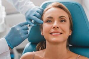 Young-looking woman in her 50s rejuvenates her appearance with liquid facelift
