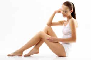 Woman admires her smooth skin on her thighs and arms thanks to Z-Shape.