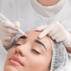 woman getting prepared for procedure of permanent eyebrow makeup